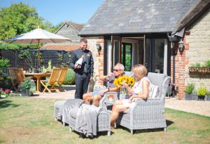 ecv nathan serving guests in garden2