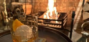 A tumbler of whisky by the fire in the Snug