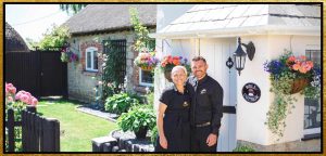 photo of Laura and Nathan in front of Well Cottage