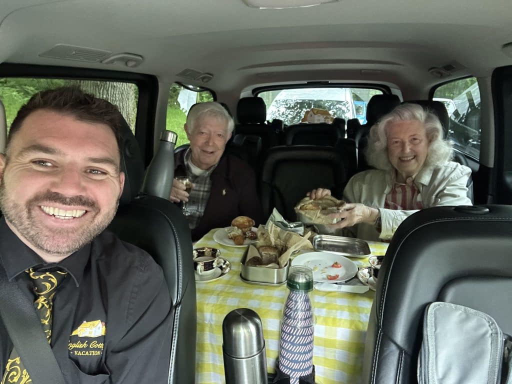 photo 3 of guests enjoying a picnic in the people carrier with Nathan photo 3 of guests enjoying a picnic in the people carrier with Nathan