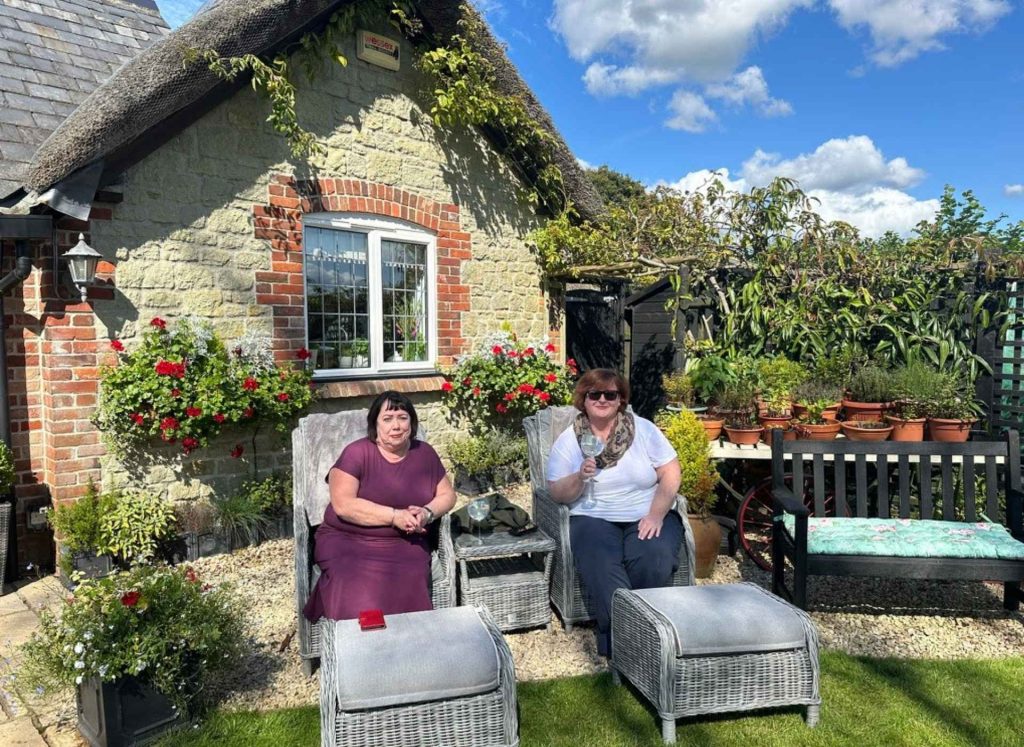 photo of English Cottage Vacation guests in the garden at Well Cottage